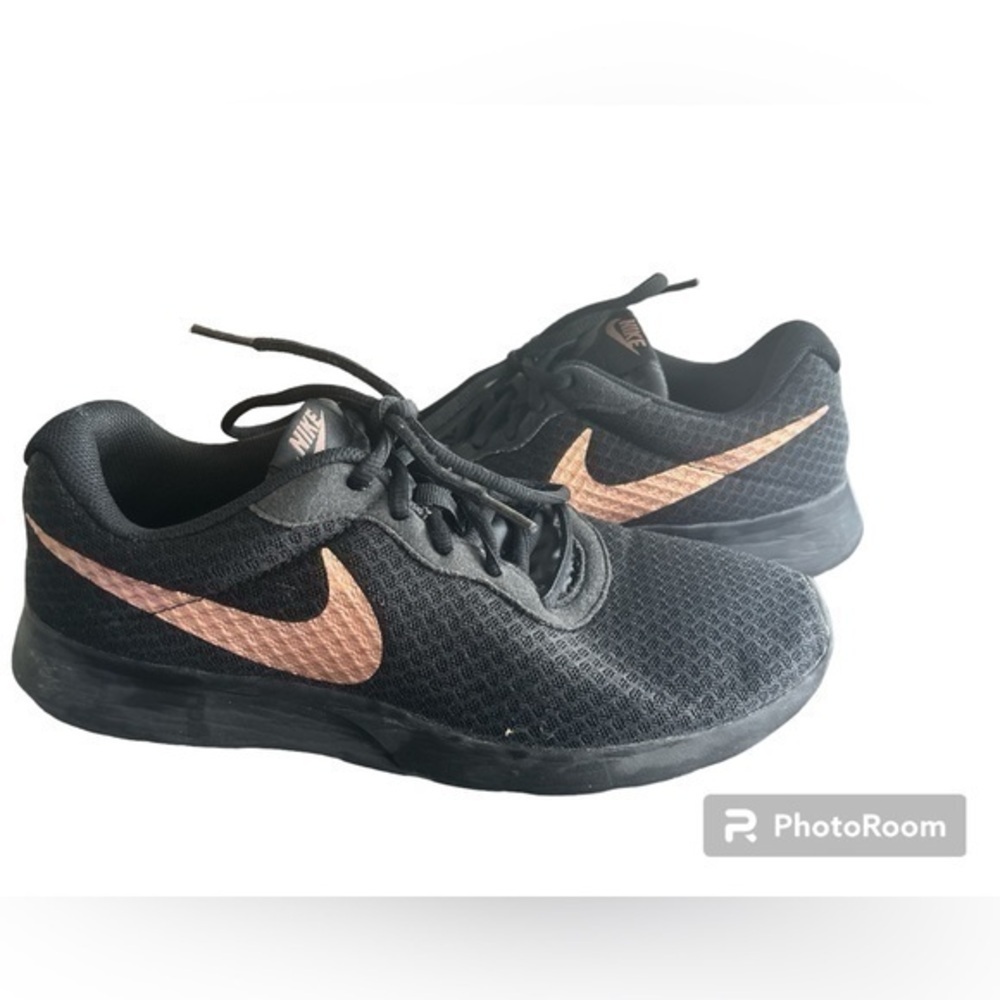 Women’s black and gold Nike running sneakers size 10